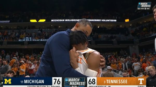 Juwan Howard hugs Kennedy Chandler