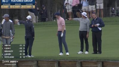 Daniel Berger looking around the course