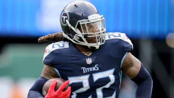 Titans RB Derrick Henry carries the ball