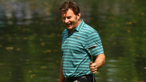 Nick Faldo holds up his putter