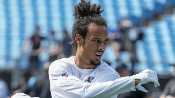Robby Anderson stretches before a game