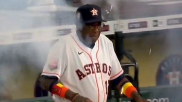 Dusty Baker walking through smoke