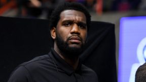 Greg Oden looks on