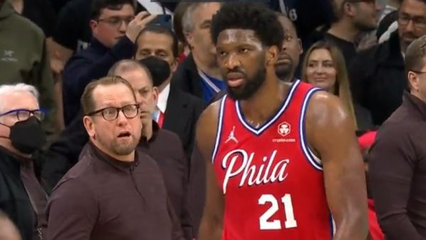 Nick Nurse looking at Joel Embiid