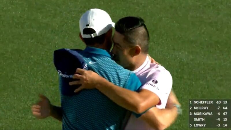 Rory McIlroy and Collin Morikawa hug