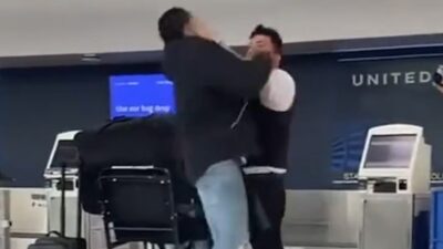 Brendan Langley in a fight with an airport employee