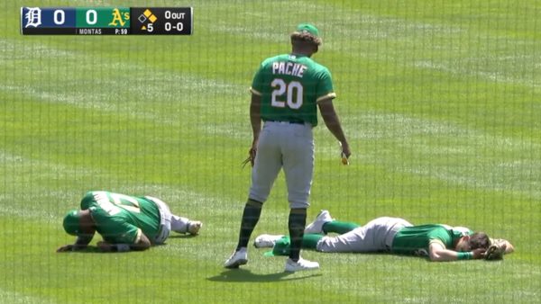 Chad Pinder and Elvis Andrus collide on a fly ball