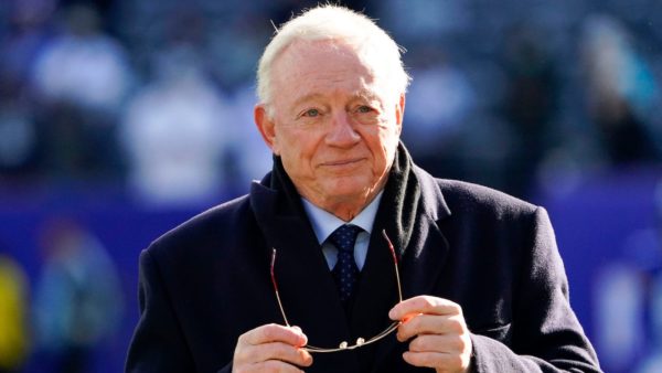 Cowboys owner Jerry Jones takes off his sunglasses