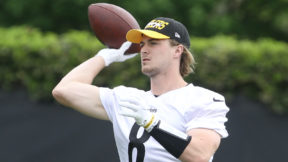 Kenny Pickett throws a pass during practice