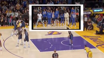 Mavericks bench celebrates a play