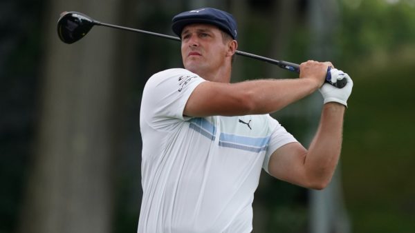 Bryson DeChambeau finishes a swing