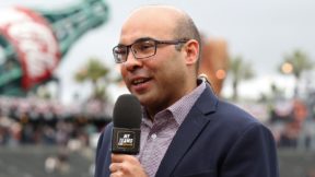 Farhan Zaidi talking into a microphone