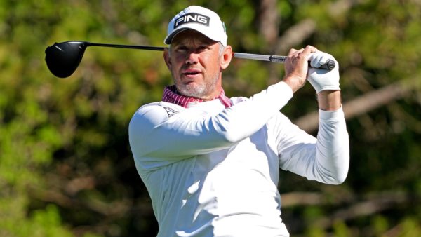 Lee Westwood finishes a swing