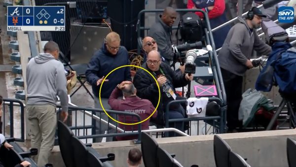 Security guard has his hand on his head