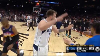 Luka Doncic high-fives a teammate