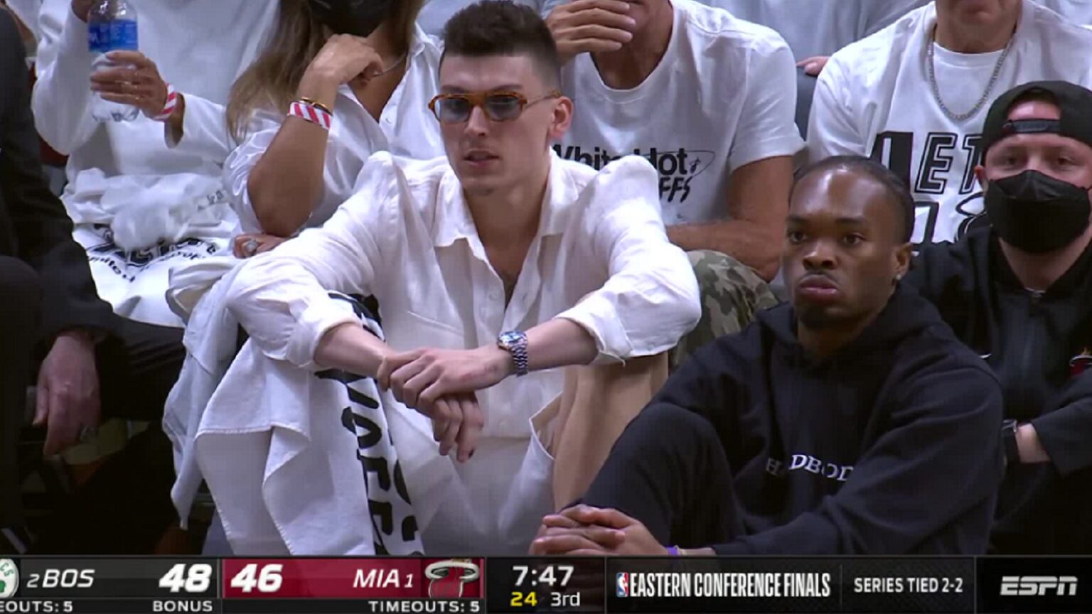 Tyler Herro wears beach outfit on bench during Game 5
