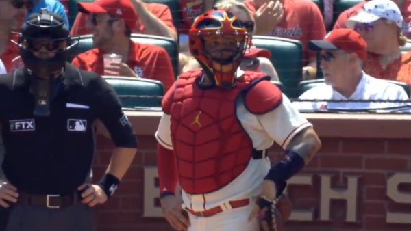 Yadier Molina checking signs