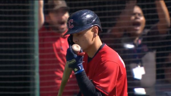 Andres Gimenez kisses the barrel of his bat