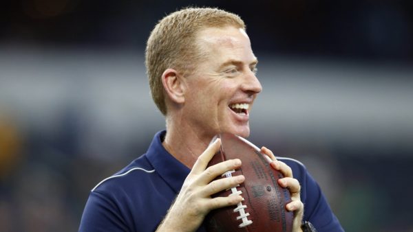 Jason Garrett holding a football