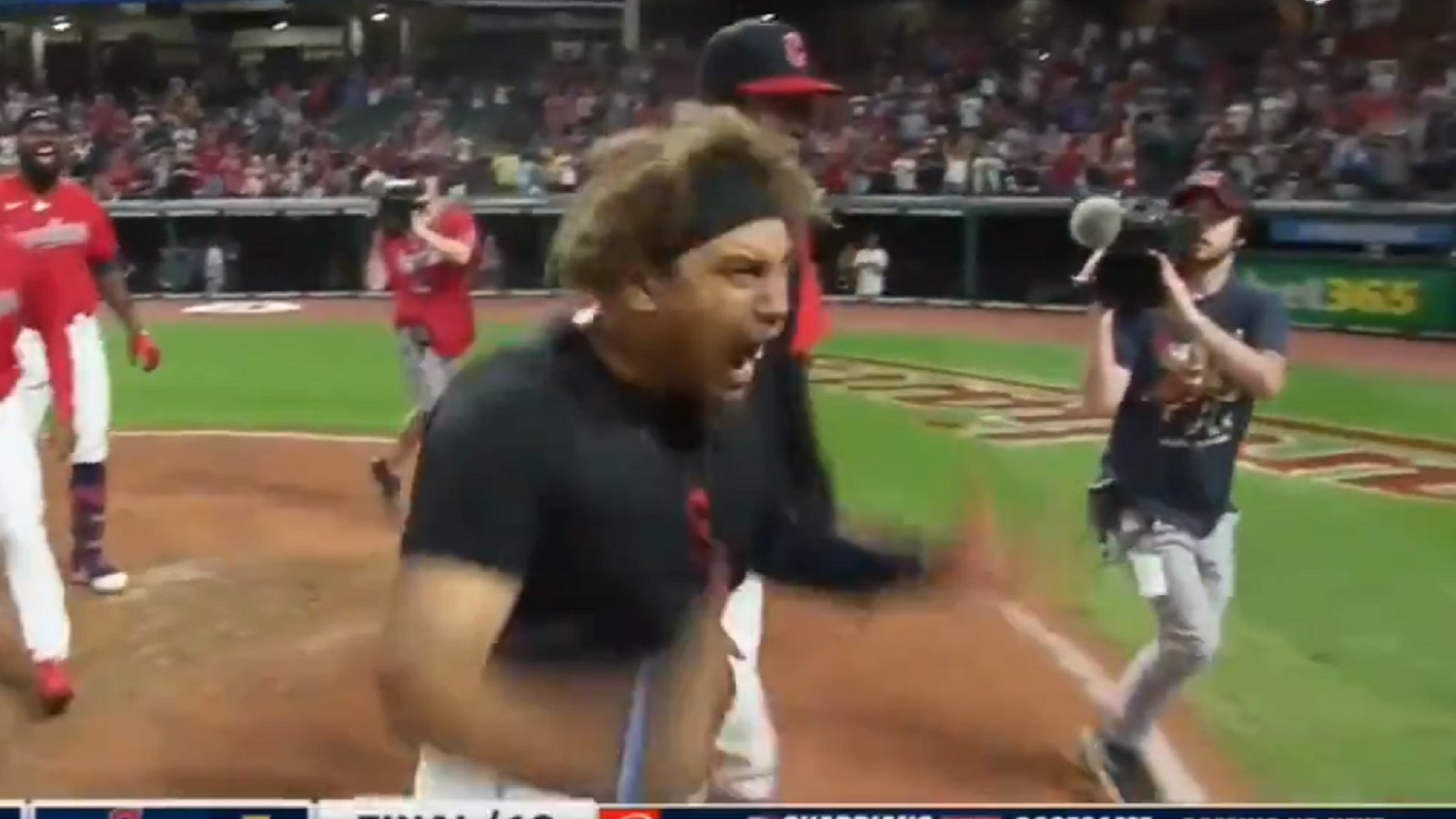 Josh Naylor celebrates after belting a solo homer