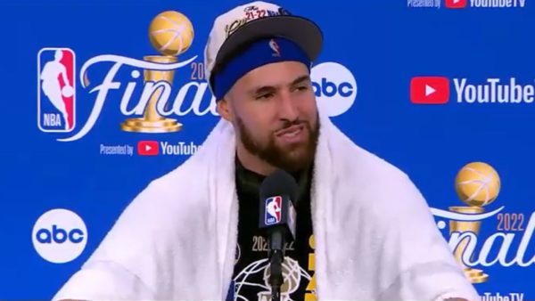 Klay Thompson talks with the media