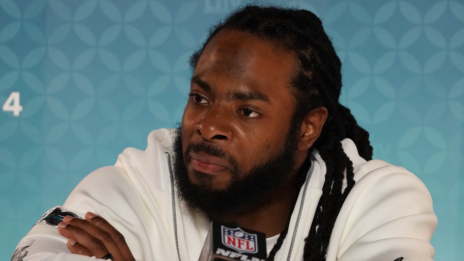 Former NFL player Richard Sherman talks in the  Prime Video broadcast  booth before a preseason NFL football game between the Los Angeles Rams and  the Houston Texans Friday, Aug. 19, 2022