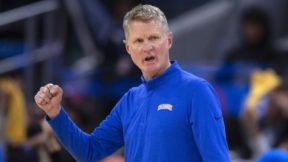 Steve Kerr in a blue warmup jacket