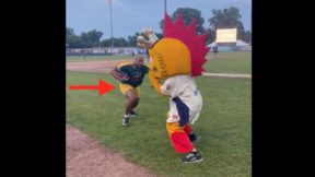 AJ Dillon hitting the Kenosha Kingfish mascot.