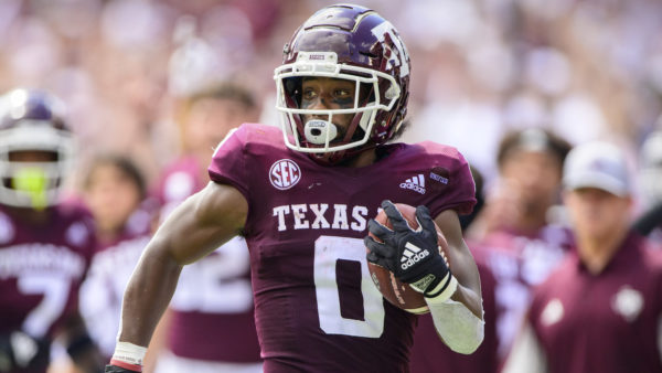 Ainias Smith running down the field