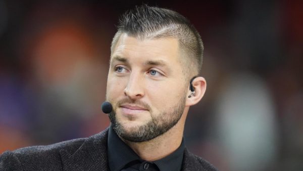 Tim Tebow wearing a broadcasting headset
