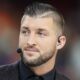 Tim Tebow wearing a broadcasting headset