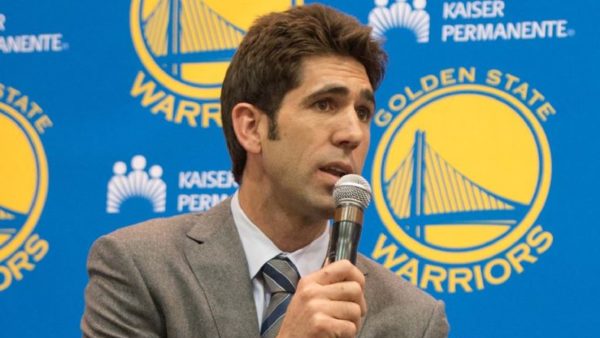 Bob Myers holding a microphone
