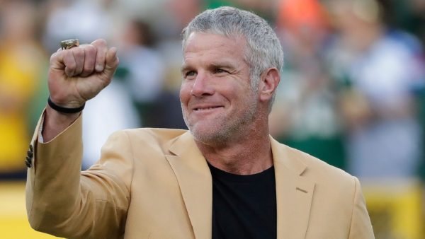 Brett Favre with an arm raised