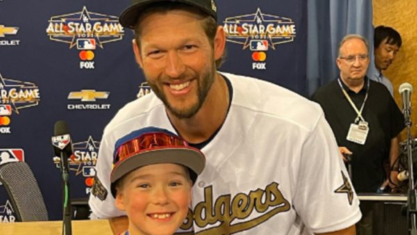 Clayton Kershaw poses with a boy