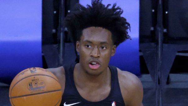 Collin Sexton holds a ball