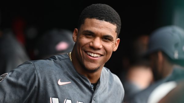 Juan Soto smiling in the dugout