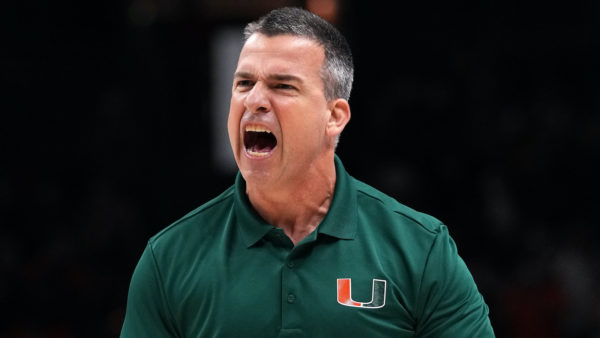 Mario Cristobal wearing a Miami Hurricanes shirt.