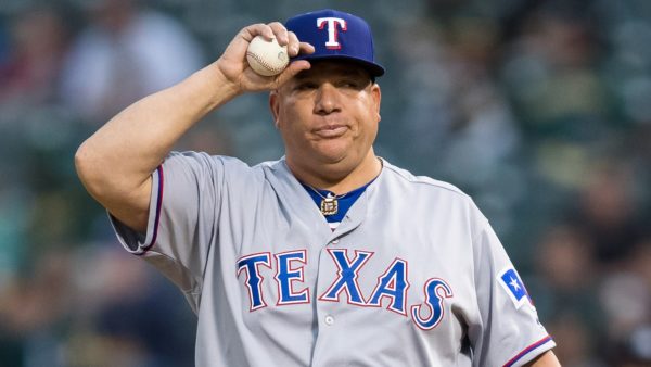 Bartolo Colon adjusts his hat