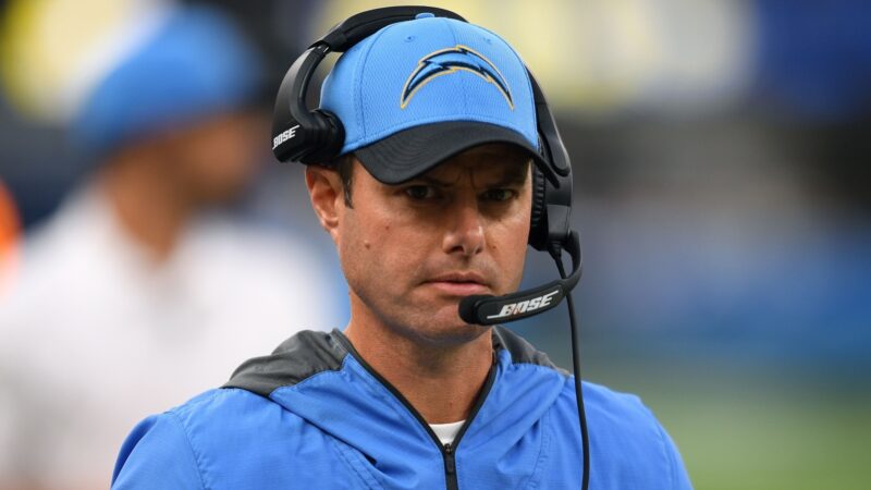 Brandon Staley wearing a headset