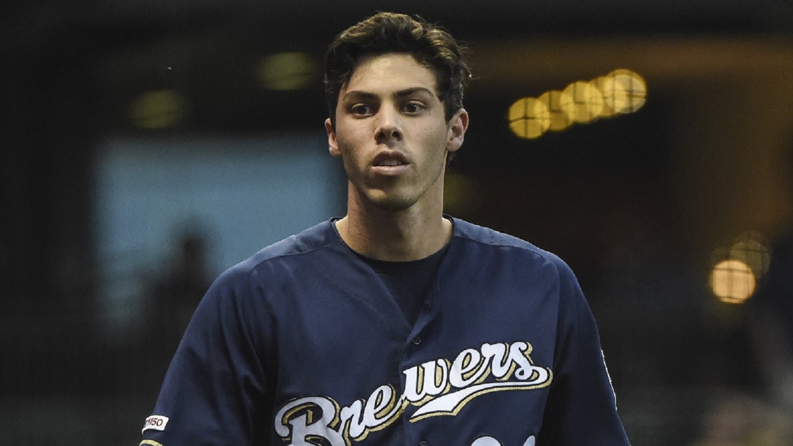 Christian Yelich of the Milwaukee Brewers walks back to the dugout