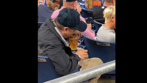Fan drinks a beer