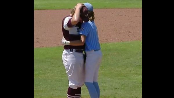 Isaiah Jarvis comforting Kaiden Shelton after Shelton hit him in the head with a pitch. 