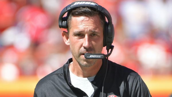 Kyle Shanahan with a headset