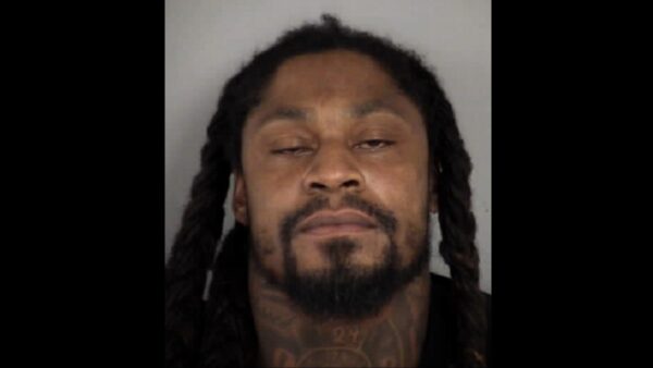 Marshawn Lynch in his mug shot