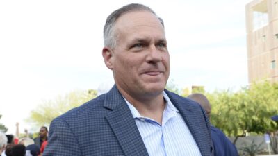 Rich Rodriguez in a suit