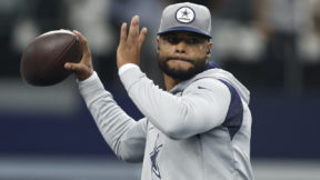 Dak Prescott throws a pass in Cowboys warmups