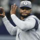 Dak Prescott throws a pass in Cowboys warmups