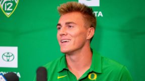 Bo Nix wearing an Oregon shirt