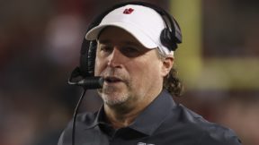 Dana Holgorsen with a headset on