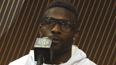 Emmanuel Sanders speaking into a mic